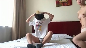 A Pair Of Lovers From China Engage In Intimate Activities In A Rented Room